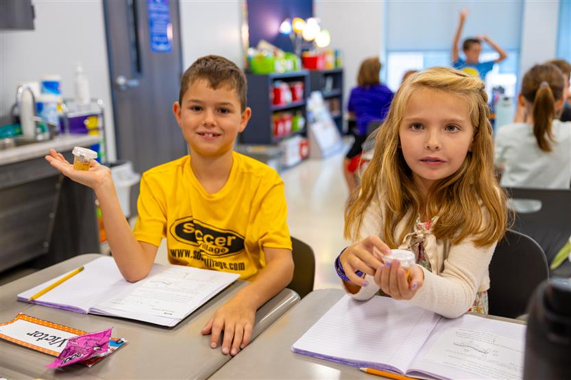 Students smile in science class